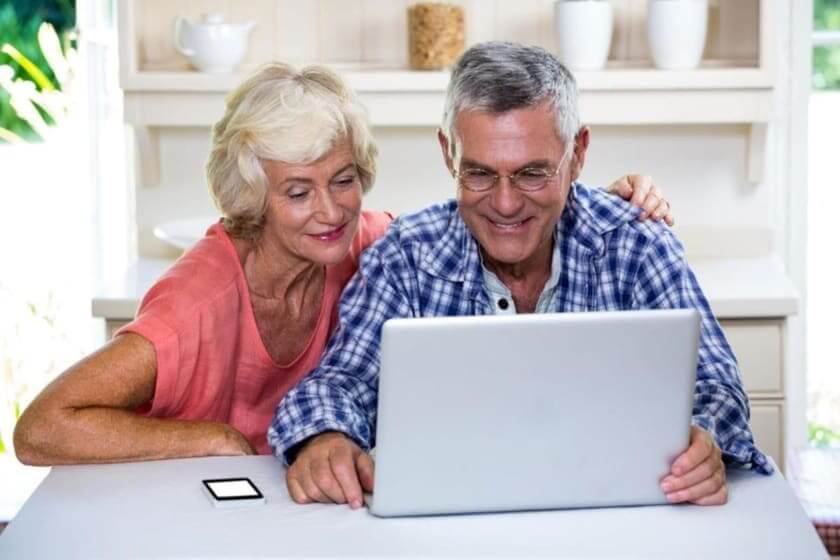 Couple researching refinancing options